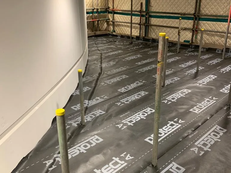 Access scaffold inside a live rail control room, with floors and walls fully protected