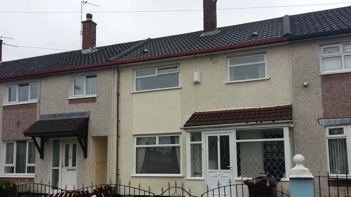 Terrace of social housing in the North West, the kind of street QED re-roofs for housing associations